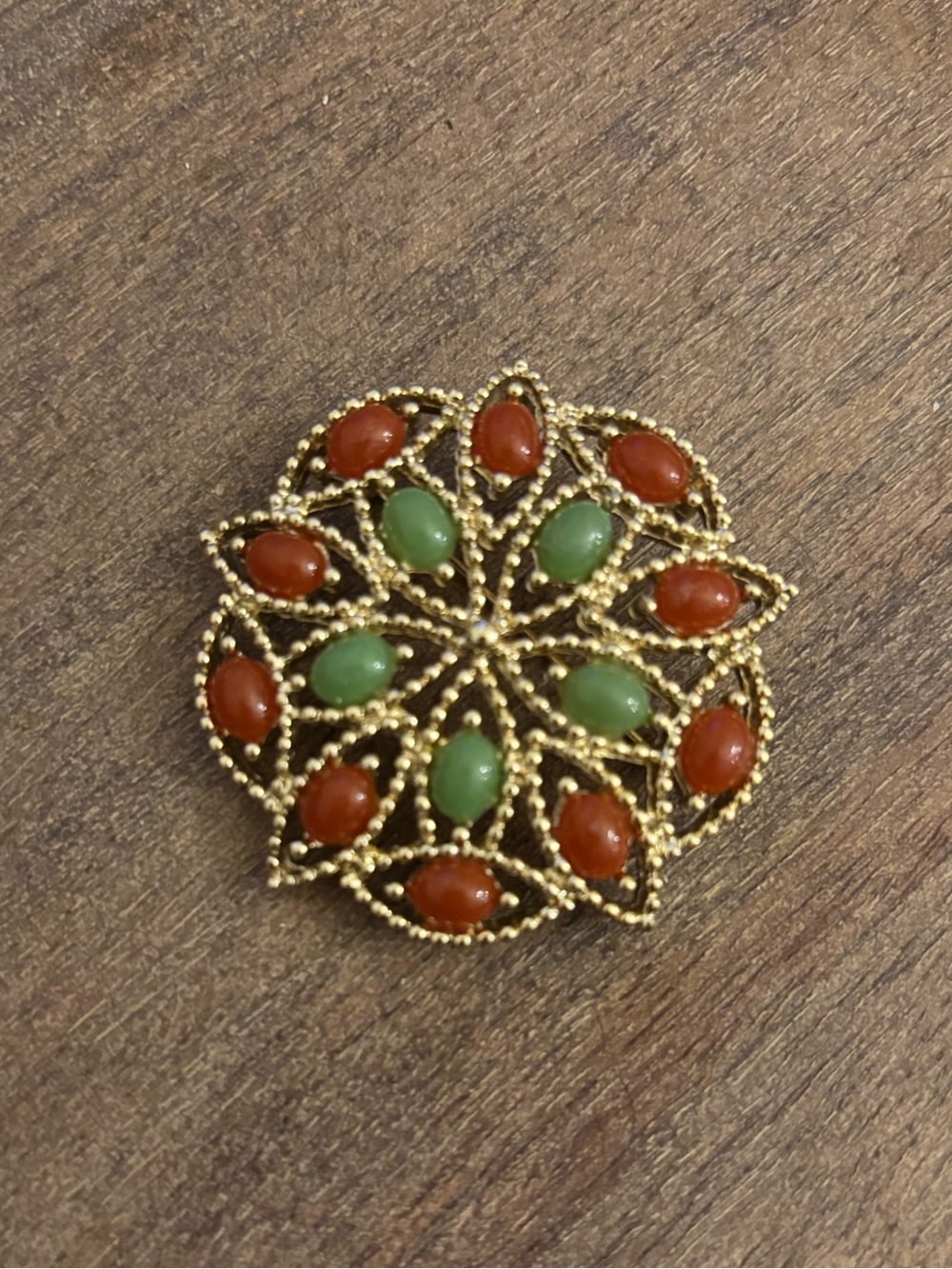 Sarah Coventry Gold-Tone Floral Brooch with Green and Red-Brown Cabochons